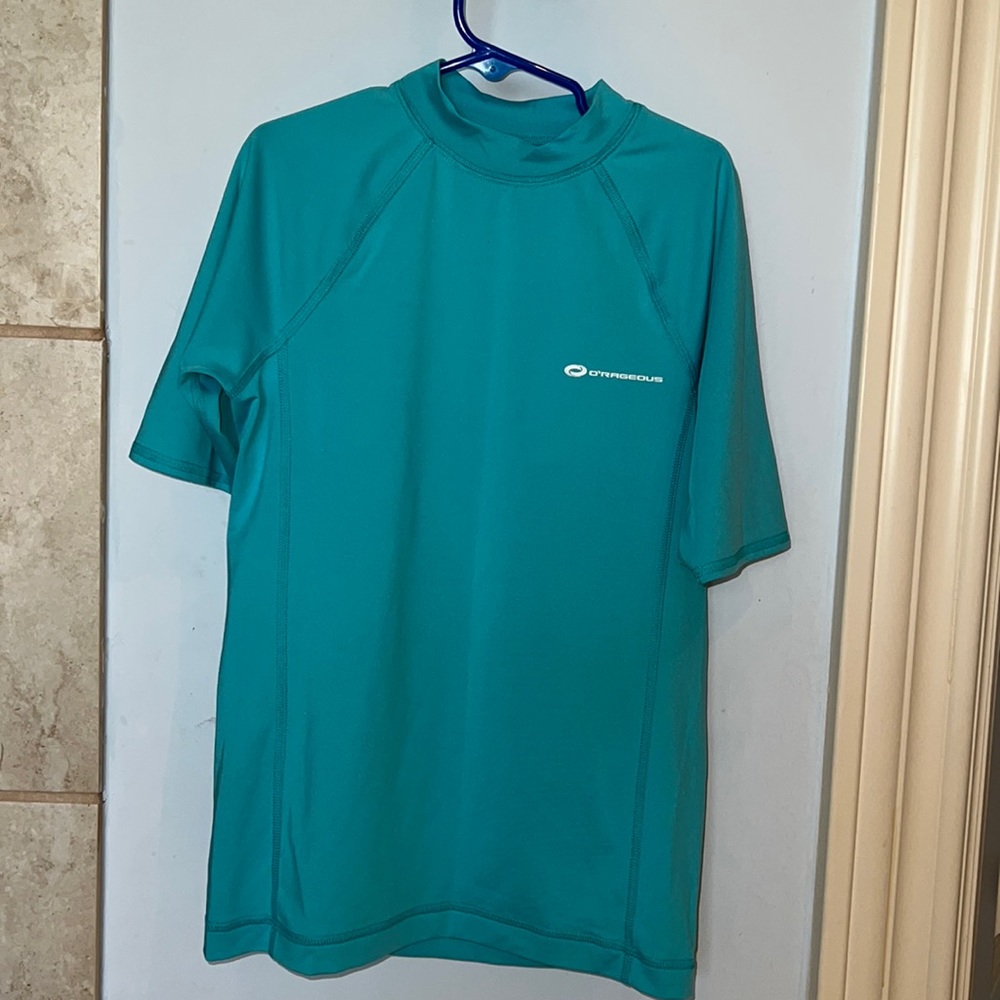 O’Rageous rash guard UV shirt, size medium for boys.  Like new.  Turquoise.